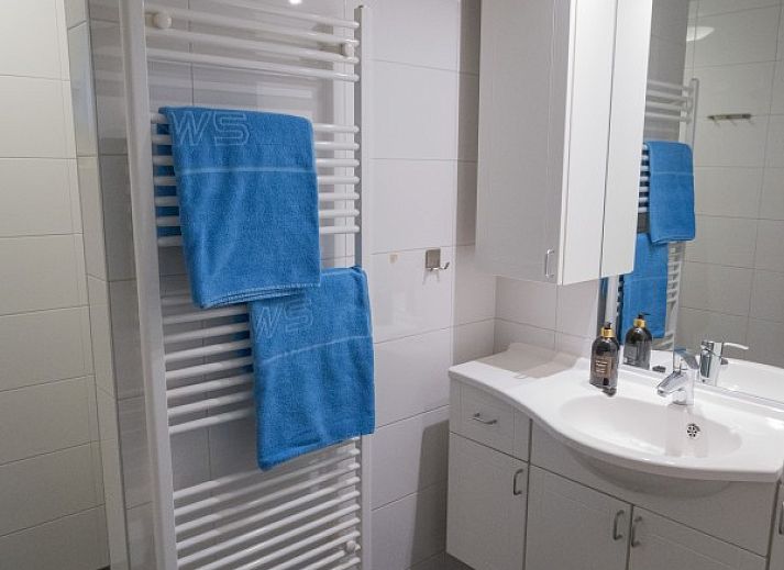 Cozy living room in vacation home Quiet in nature, Lage Mierde, with comfortable seating and stylish decor.