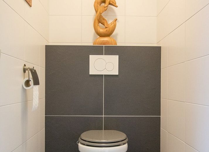 Cozy living room in vacation home Quiet in nature, Lage Mierde, with comfortable seating and stylish decor.