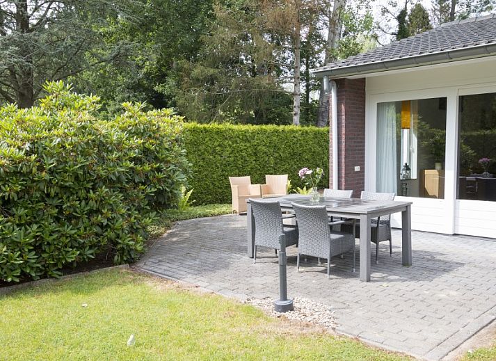 Cozy living room in vacation home Quiet in nature, Lage Mierde, with comfortable seating and stylish decor.