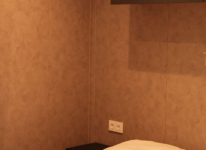 Geniessen Sie die Veranda des Huisje in Bergeijk, Ferienhaus im gruenen Kempen, Nordbrabant.