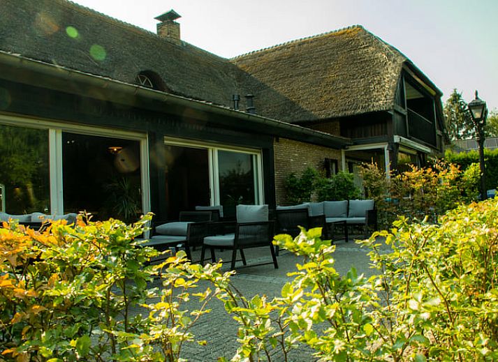 Charmante buitenkant van Vakantiehuis in Baarle-Nassau, omgeven door groene natuur in de Kempen, Noord Brabant.