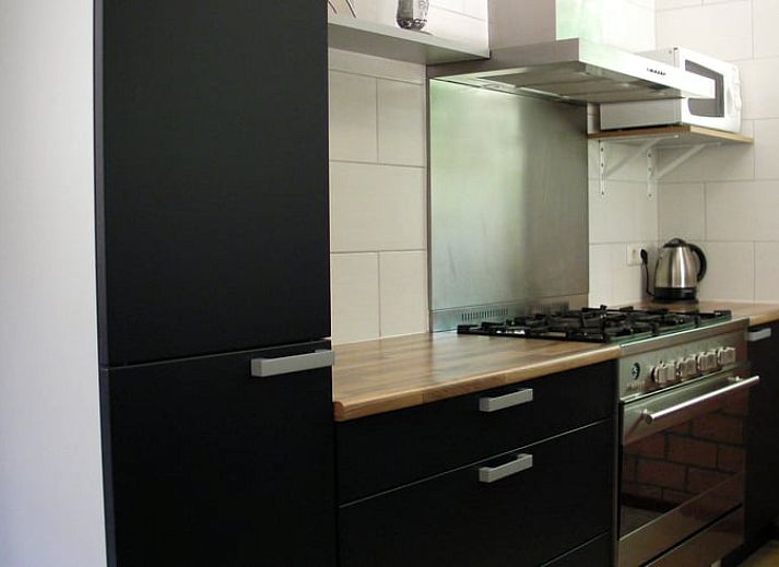 Veranda van Vakantiehuisje in Luyksgestel met uitzicht op de groene omgeving in de Kempen.