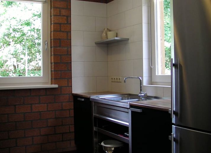 Veranda van Vakantiehuisje in Luyksgestel met uitzicht op de groene omgeving in de Kempen.