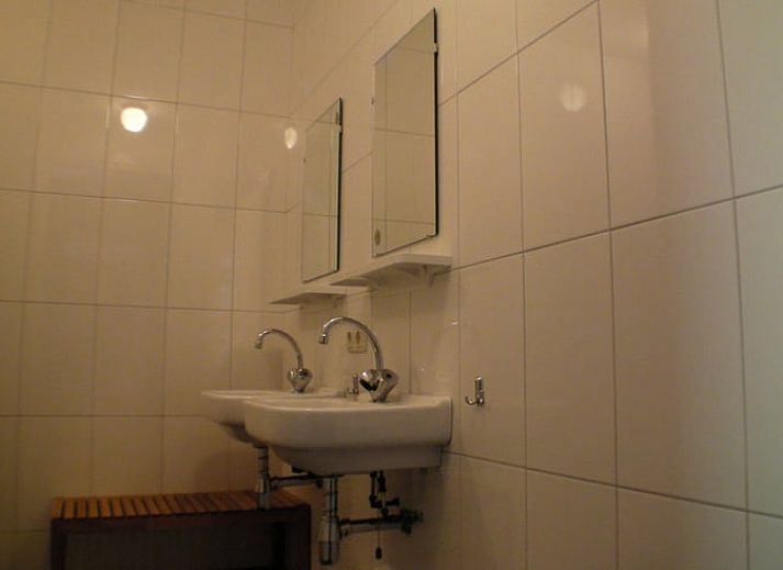 Veranda van Vakantiehuisje in Luyksgestel met uitzicht op de groene omgeving in de Kempen.