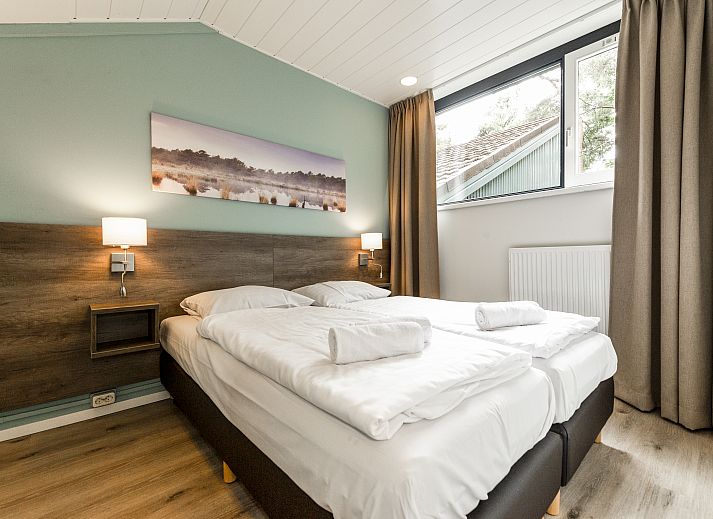 Komfortable Sitzecke mit Treppe im 6-Personen-Bungalow Het Vennenbos, Hapert, Nordbrabant.