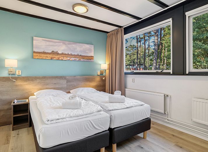 Comfortable sitting area in Het Vennenbos bungalow, ideal for relaxation in Hapert.