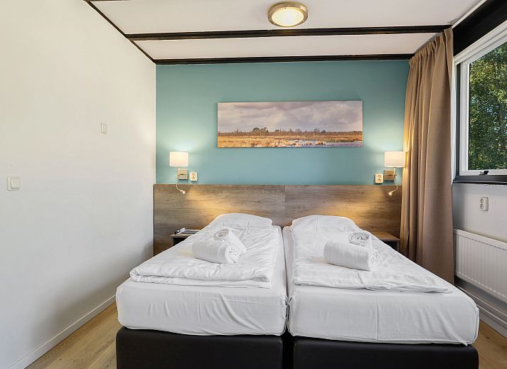 Comfortable sitting area in Het Vennenbos bungalow, ideal for relaxation in Hapert.