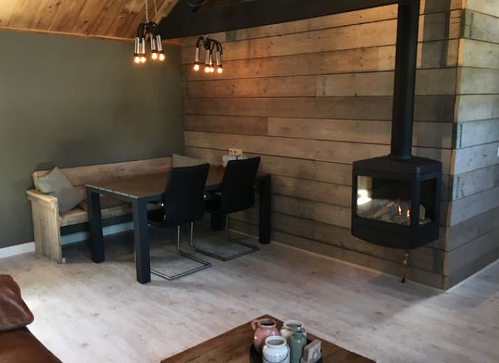 Cozy living room in Holiday home in Oisterwijk, North Brabant, with fireplace and comfortable seating area for a relaxing stay.