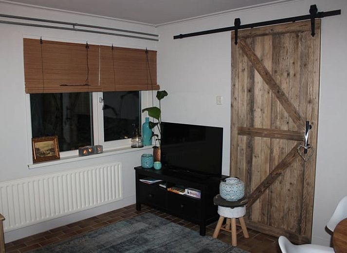 Vakantiehuisje in Oisterwijk met ruim terras en groene omgeving, perfect voor een verblijf in Hart van Brabant.