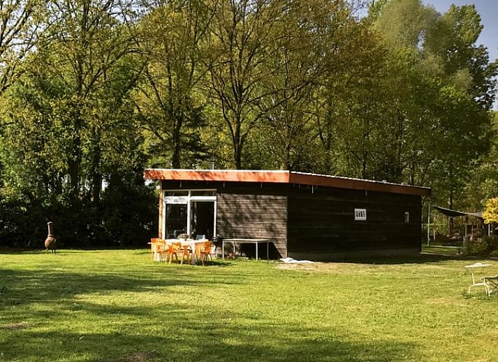 Cozy dining area in Holiday home in Liempde, Heart of Brabant overlooking the green garden.