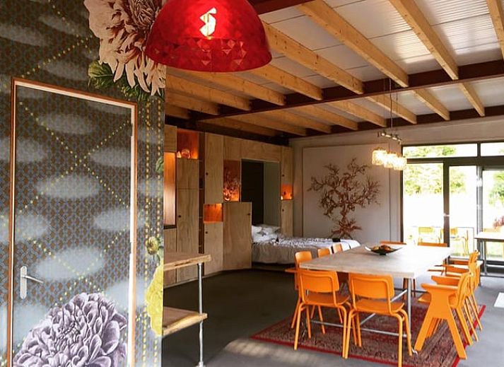 Cozy dining area in Holiday home in Liempde, Heart of Brabant overlooking the green garden.