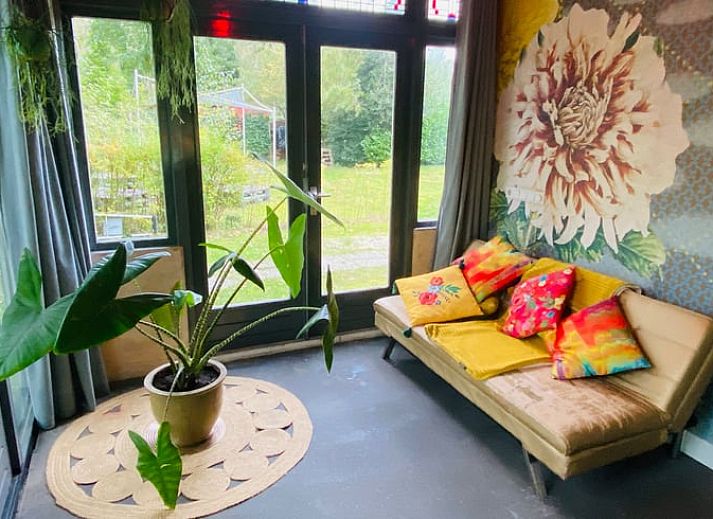 Cozy dining area in Holiday home in Liempde, Heart of Brabant overlooking the green garden.