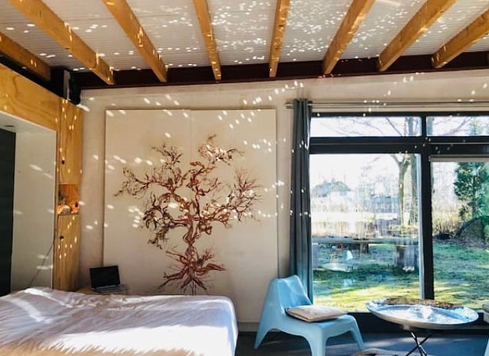 Cozy sitting area in Holiday home in Liempde overlooking the garden, North Brabant.