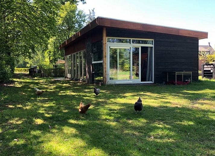 Cozy sitting area in Holiday home in Liempde overlooking the garden, North Brabant.