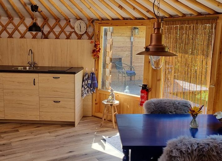 Exterior view of Holiday home in Liempde, Heart of Brabant with colorful flowers and green surroundings.