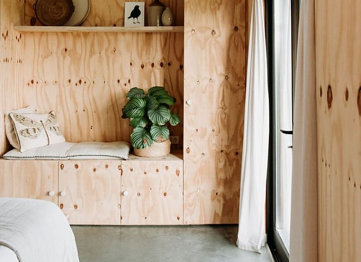 Charming entrance to Holiday home in Chaam, North Brabant with wooden facade and veranda in Heart of Brabant.