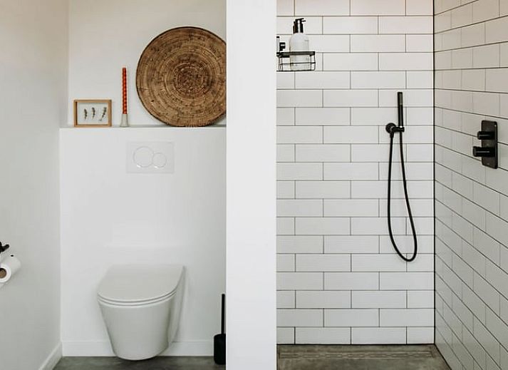 Relaxing garden with deck chairs at Holiday home in Chaam, surrounded by nature in North Brabant.