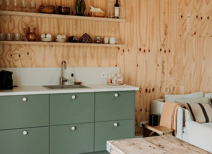 Relaxing garden with deck chairs at Holiday home in Chaam, surrounded by nature in North Brabant.