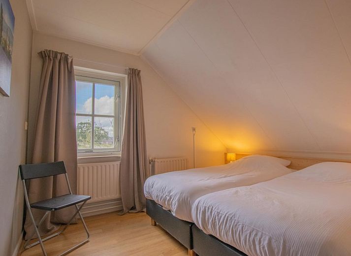 Ruime zithoek in By Romme vakantiehuis, ideaal voor ontspanning in Brabant.