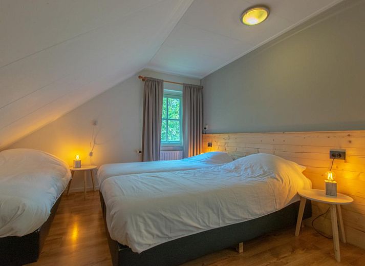 Ruime zithoek in By Romme vakantiehuis, ideaal voor ontspanning in Brabant.