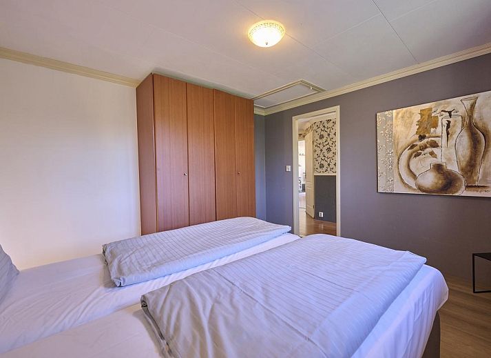 Gemuetliche Sitzecke mit Holzofen in 't Kaatsheuveltje 2, einem gemuetlichen Ferienhaus in Kaatsheuvel, Nordbrabant.