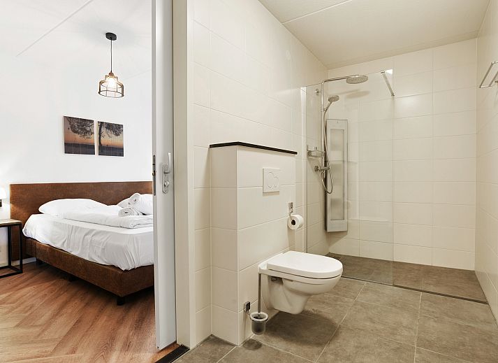 Spacious living room of the vacation home Kaatsheuvel, perfect for 12 people, in North Brabant.