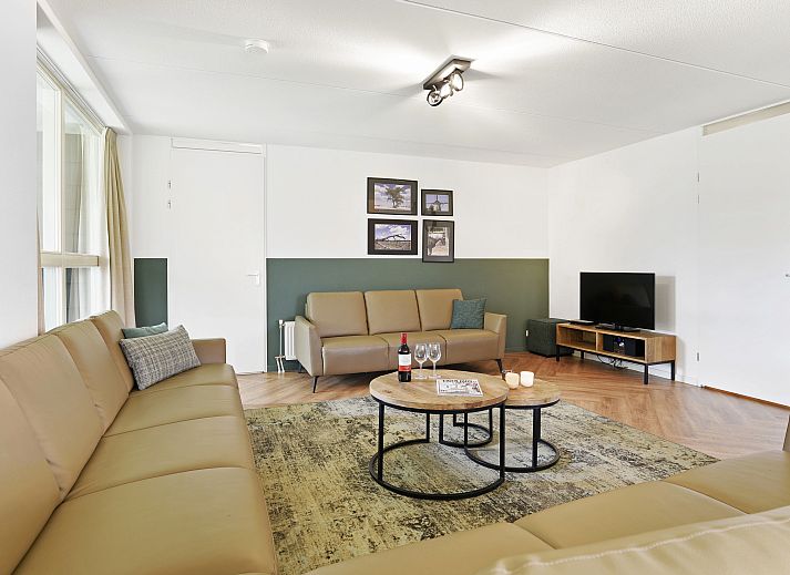Comfortable sitting area in the 12-person vacation home Kaatsheuvel, Hart van Brabant.