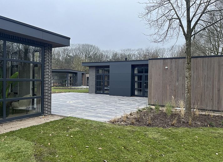 Stylish living room of the Detached house in Kaatsheuvel, Heart of Brabant, overlooking the green garden through large windows.