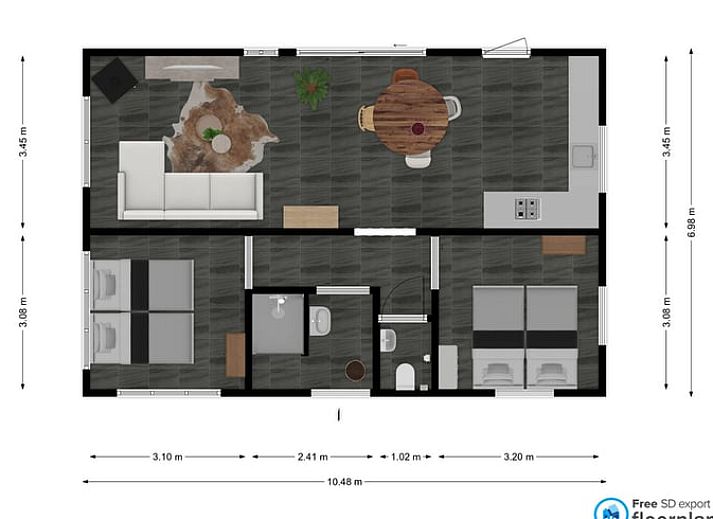 Essecke im Ferienhaus in Leende, Hart van Brabant, Nordbrabant mit Holztisch und stimmungsvoller Beleuchtung.