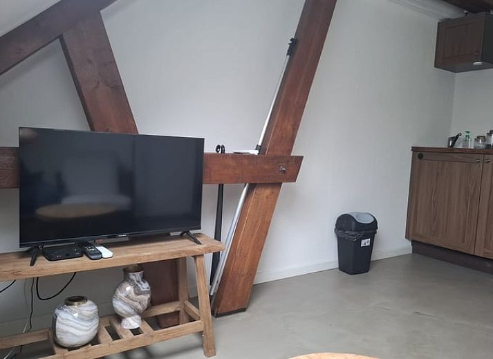 Karakteristieke groene luiken van Vakantiehuisje in Hank, Noord Brabant, benadrukken de authentieke charme van dit vakantiehuis in Hart van Brabant.