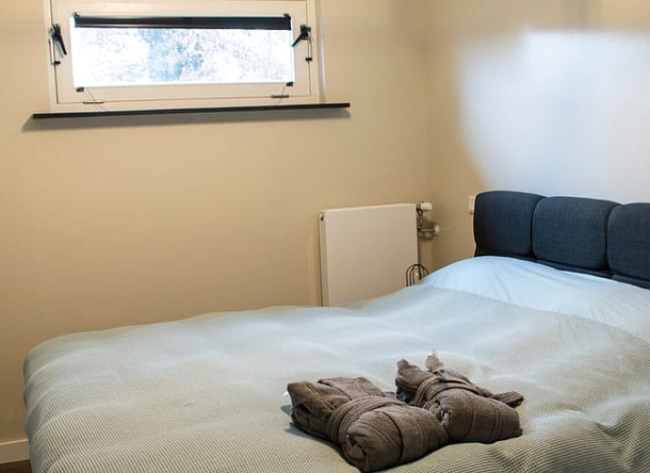 Cozy living room with spiral staircase in Holiday home in Boxtel, Heart of Brabant, North Brabant.