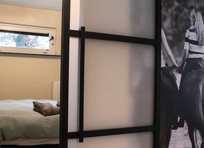 Stylish dining room with art on the wall in Holiday home in Boxtel, Heart of Brabant, North Brabant.
