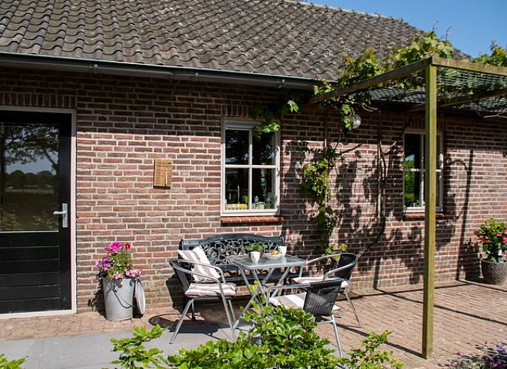 Stylish dining room with art on the wall in Holiday home in Boxtel, Heart of Brabant, North Brabant.