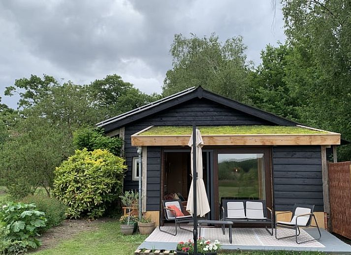 Cozy sitting area in cottage in Boxtel, Lennisheuvel, Heart of Brabant, North Brabant, overlooking the garden.