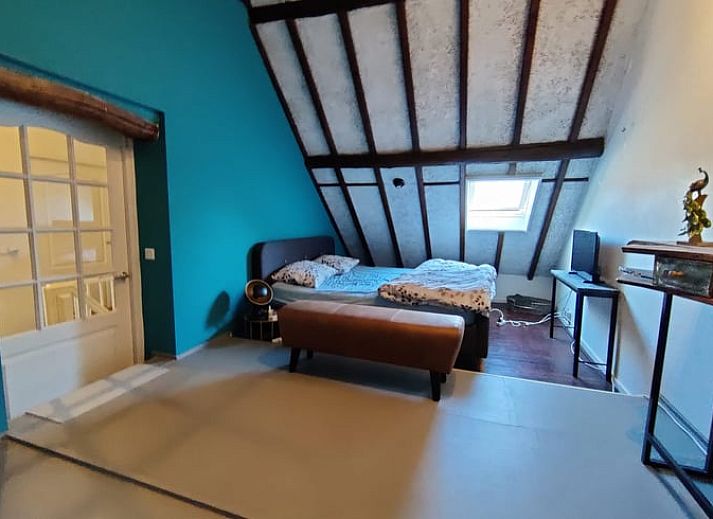 Cozy living room in Holiday home in Best, Heart of Brabant, with rustic decor and plenty of natural light in North Brabant.