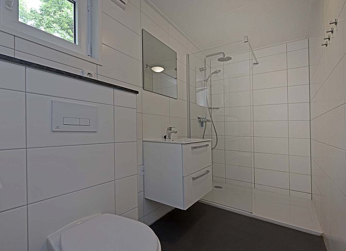 Binnenruimte van Vrijstaande woning in Schaijk, Noord Brabant, met gezellige zithoek en moderne keuken.