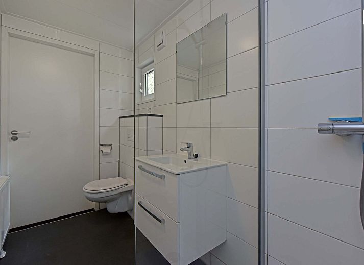 Binnenruimte van Vrijstaande woning in Schaijk, Noord Brabant, met gezellige zithoek en moderne keuken.