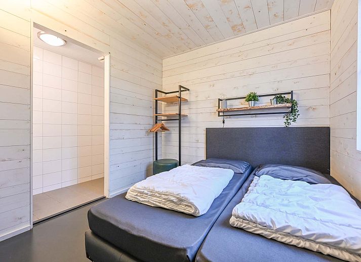 Vrijstaande woning in Schaijk, Noord Brabant, met uitzicht op omliggende bomen.