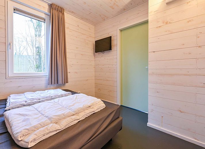 Vrijstaande woning in Schaijk, Noord Brabant, met uitzicht op omliggende bomen.