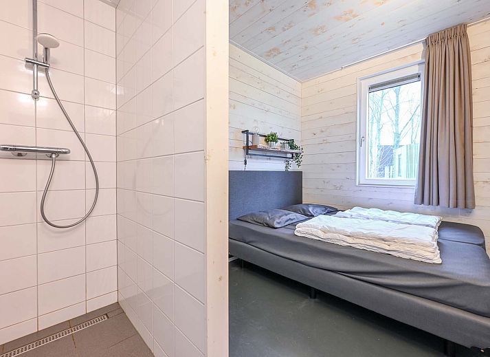 Vrijstaande woning in Schaijk, Noord Brabant, met uitzicht op omliggende bomen.