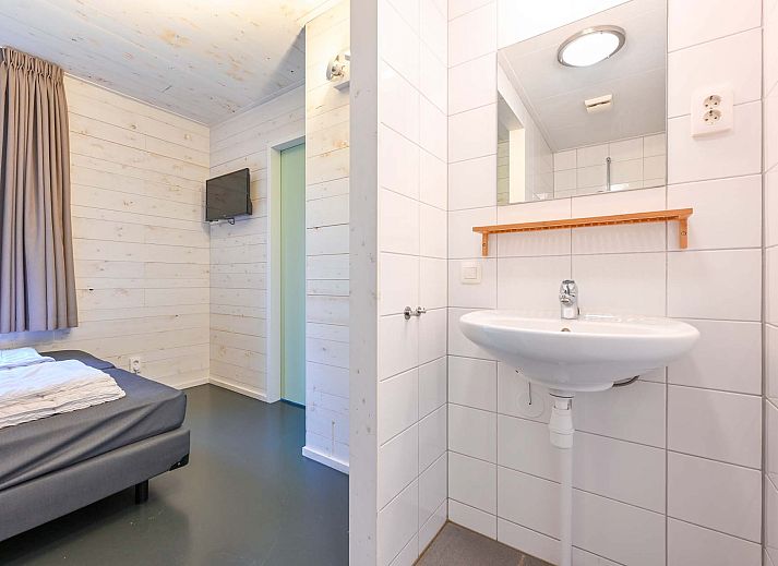 Vrijstaande woning in Schaijk, Noord Brabant, met uitzicht op omliggende bomen.