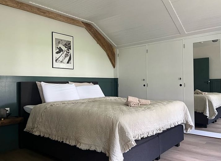 Gezellige zithoek in de tuin van Vakantiehuis in Overloon, omgeven door natuur in Noordoost Brabant.