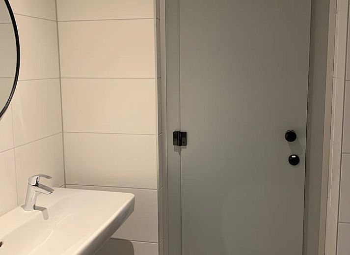 Gezellige binnenruimte van Huisje in Nistelrode, vakantiehuis in Noordoost Brabant met comfortabele zithoek en ruime eetkamer.