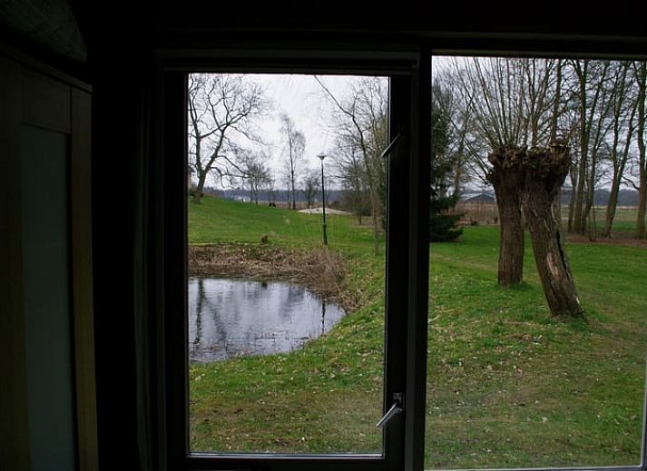 Cozy vacation home in Escharen, Northeast Brabant, surrounded by nature and pond.