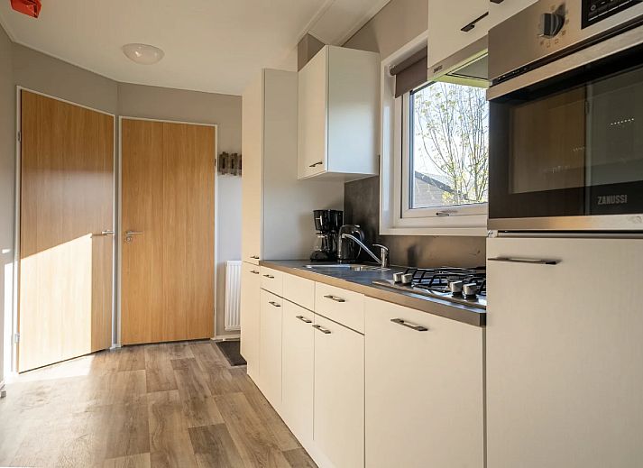 Cozy living room of detached house in Linden, Northeast Brabant, with comfortable sofas and lots of natural light.