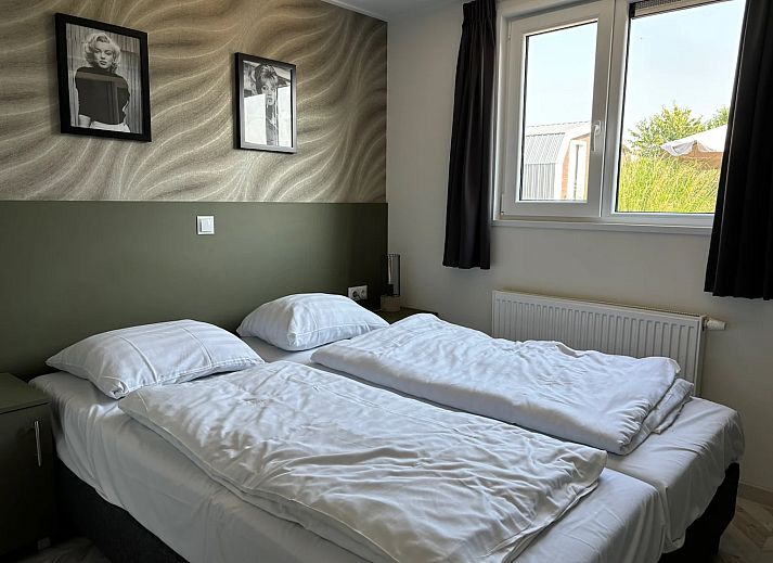 Freistehendes Haus in Linden, Nordost-Brabant, ein Ferienhaus mit grozgiger Terrasse und moderner Architektur, umgeben von Natur.