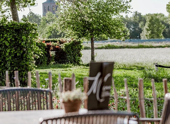 Buitenaanzicht van Vakantiehuisje in Sint-Oedenrode, Noord Brabant met landelijke charme.
