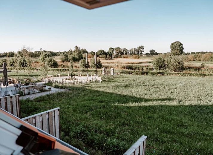 Buitenaanzicht van Vakantiehuisje in Sint-Oedenrode, Noord Brabant met landelijke charme.