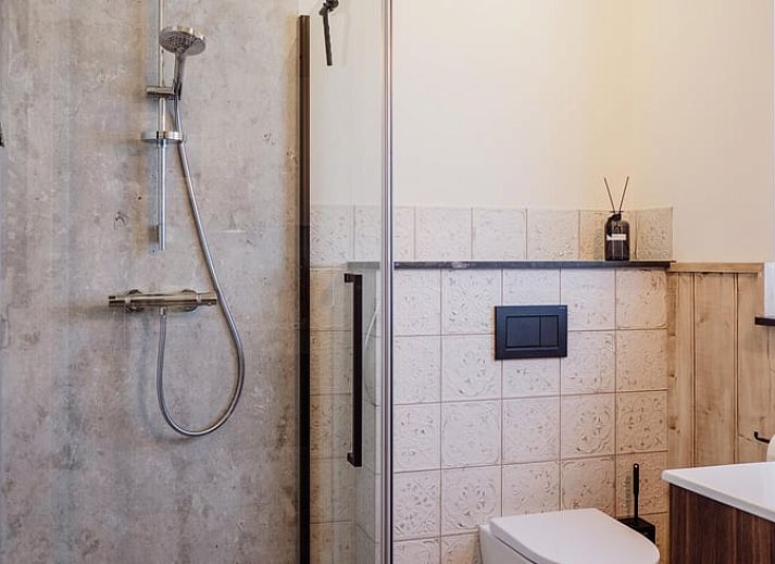 Voorzijde van Vakantiehuisje in Sint-Oedenrode, Noordoost Brabant met authentieke bakstenen.