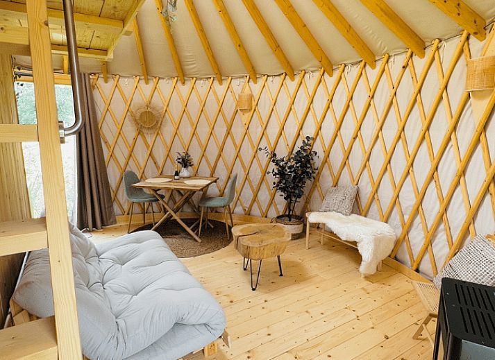 Bright interior of Holiday Home in Ledeacker with comfortable seating and wooden interior.